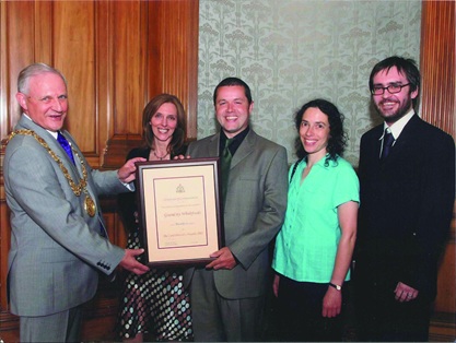 A picture of Greencity members proudly recieving an award from the lord Provost
