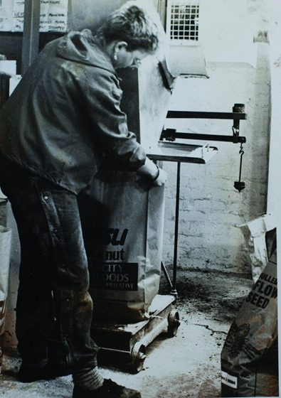 A past greencity member carrying a sack of pulses
